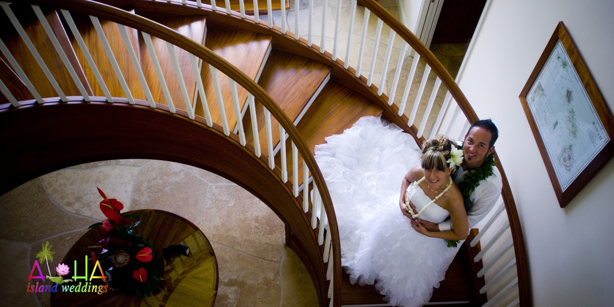 Newlyweds seen from above on the estate house's spiral staircase